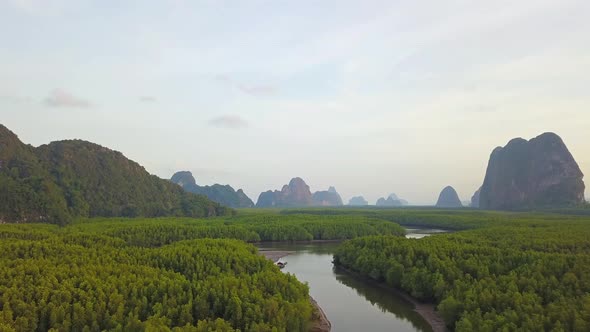 Aerial top view of Samet Nangshe, mountain valley hills, and tropical green forest alt