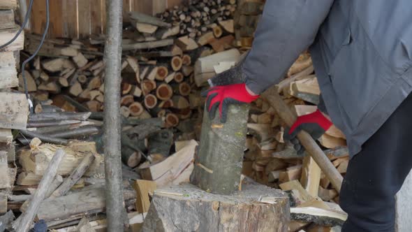 A Man in the Village is Chopping Wood