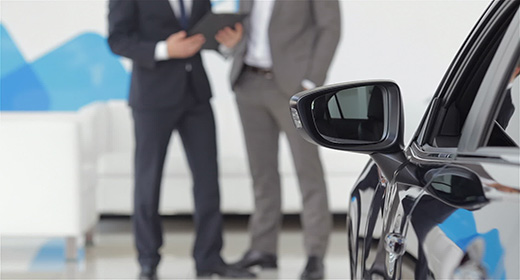 Man at a car dealership buying an auto