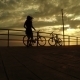 Girl On Bicycles At Sunset Sea - VideoHive Item for Sale