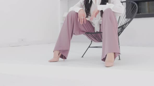 Young Attractive Spectacular Model in a Photo Shoot in a White Studio alt