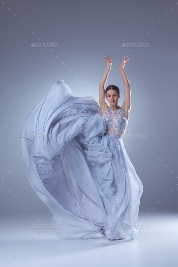 The beautiful ballerina dancing in blue ...