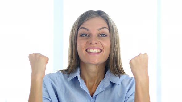 Portrait of Beautiful Young Woman Celebrating Success alt