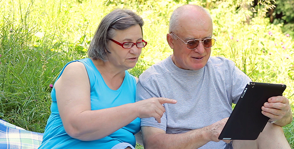 Senior Couple with Digital Tablet Pc alt