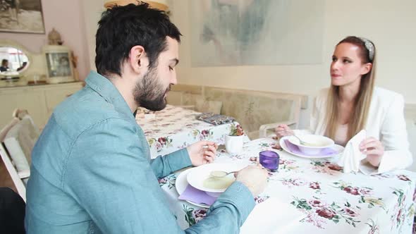 Young Couple Eating Soup In A Restaurant 3 alt