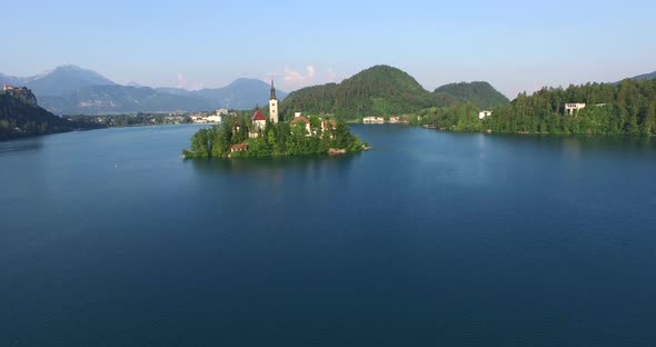 Slow Aerial View Of Little Island On The Slovenian Lake Bled. 1 alt
