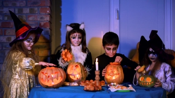 Children In Halloween Costumes Playing With