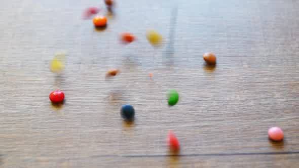 Wooden Table With Falling Candies