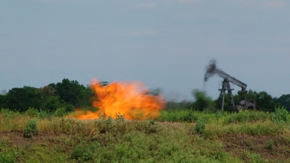 Flare Stack Burning In Oil Well While Producing