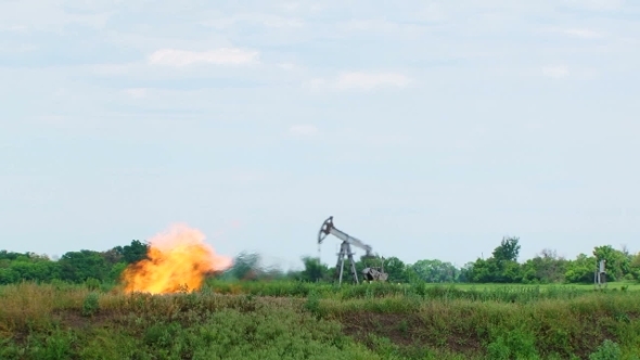 Flare Stack Burning In Oil Well While Producing