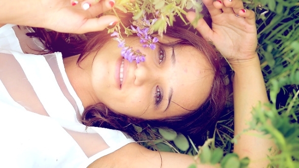 Young Cute Summer Brunette Girl  Lays Down In