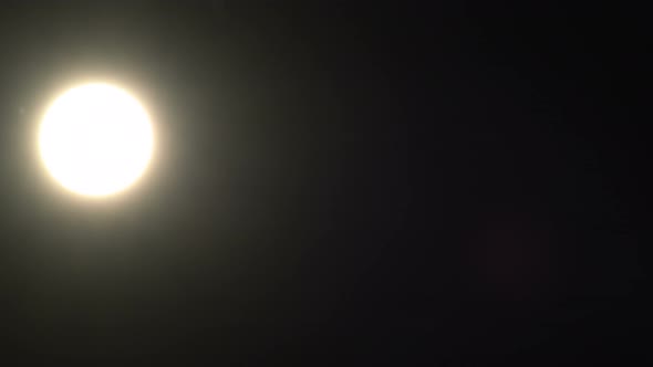 Sun in the dark sky at sunset alt