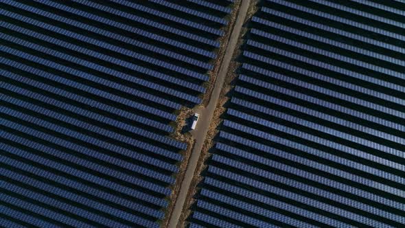Aerial Drone Footage. Flight Over Solar Panel Farm Top Down View. Renewable Green Alternative Energy