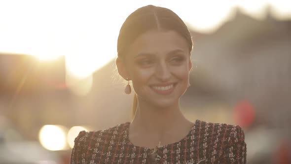 Jolly Gorgeous Lady in Trendy Jacket in Sunlight