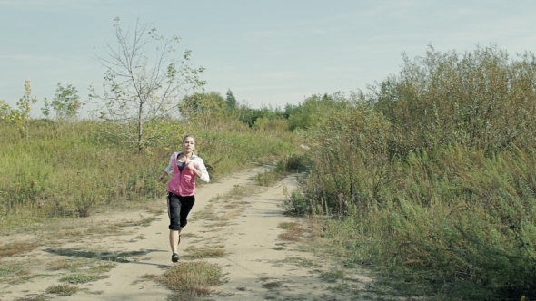 Athletic Girl Jogging In The Country