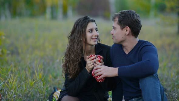 Couple Drink Tea In A Park alt