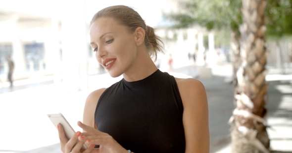 Pretty Business Woman Using Cell Phone alt