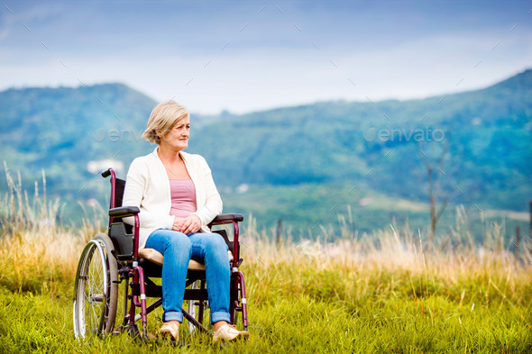 Woman in wheelchair - Stock Photo - Images