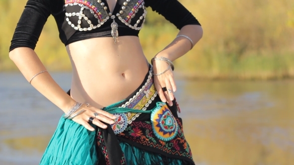 Beautiful  Girl Dancing Exotic Dance On Beach