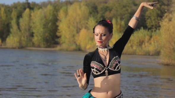 Beautiful  Girl Dancing Exotic Dance On Beach