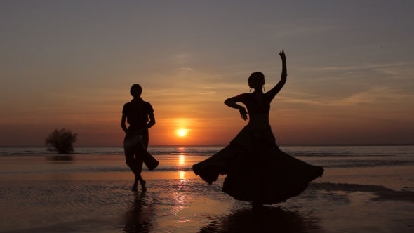 Silhouette Girl Dancing Exotic Dance With Drummer