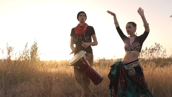 Beautiful  Girl Dancing Exotic Dance With Drummer