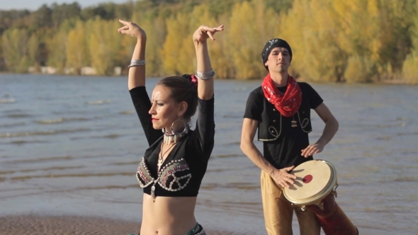 Beautiful  Girl Dancing Exotic Dance With Drummer