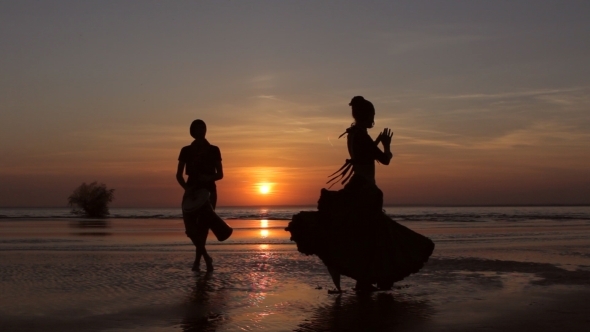 Silhouette Girl Dancing Exotic Dance With Drummer