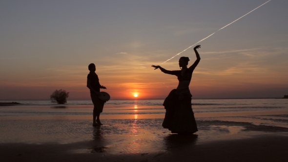 Silhouette Girl Dancing Exotic Dance With Drummer