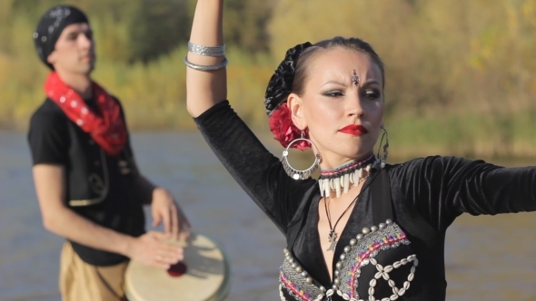 Beautiful  Girl Dancing Exotic Dance With Drummer