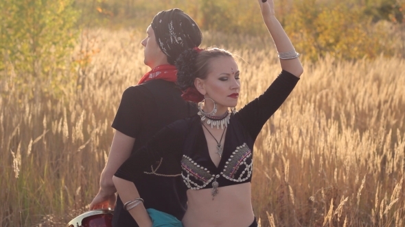 Beautiful  Girl Dancing Exotic Dance With Drummer