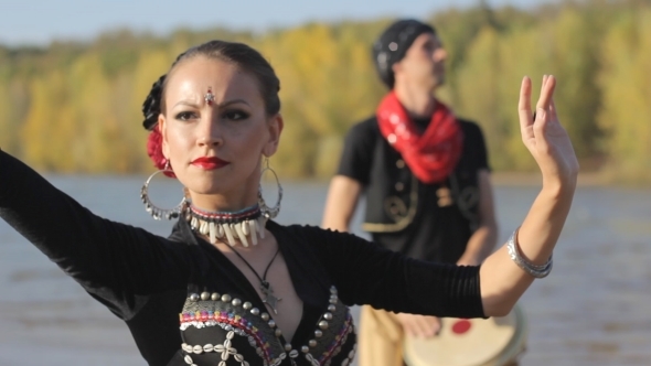 Beautiful  Girl Dancing Exotic Dance With Drummer