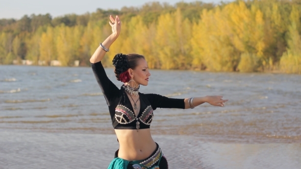 Beautiful  Girl Dancing Exotic Dance On Beach