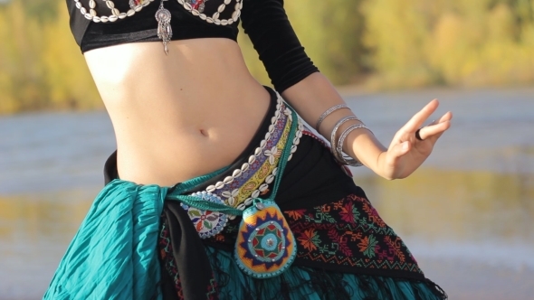 Beautiful  Girl Dancing Exotic Dance On Beach