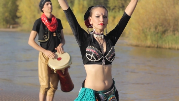 Beautiful  Girl Dancing Exotic Dance With Drummer