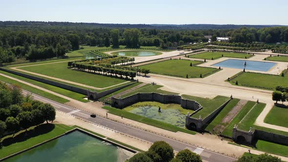 Aerial View of Medieval Landmark Royal Hunting Castle Fontainbleau and Lake with White Swans, France