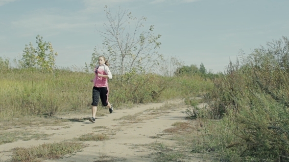 Woman In Sportswear Running Outdoors