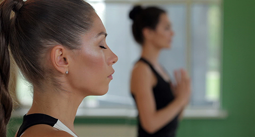 Young girls do yoga indoors