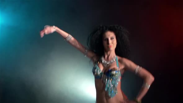 Beautiful Young Belly Dancer Go on Dancing, Slow Motion, in Smoke alt