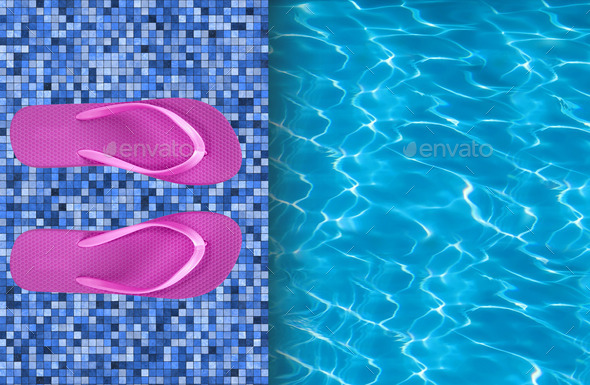 Swimming pool and pink beach shoes on tile