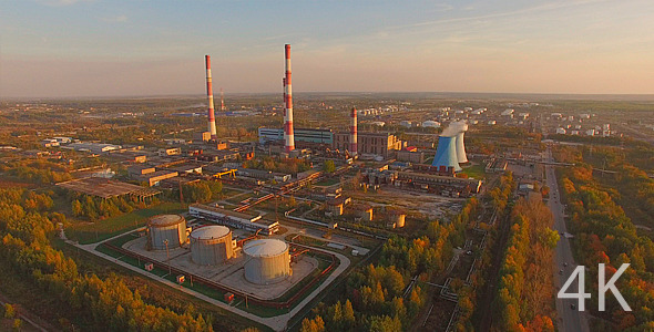 Beautiful Industrial Plant with Pipes at Sunset alt