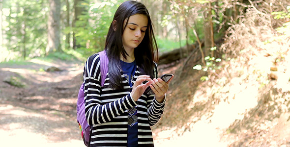 Young Girl Tourist Using Smartphone  alt