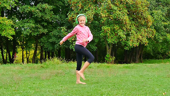 Adorable Little Girl Dancing In The Park alt