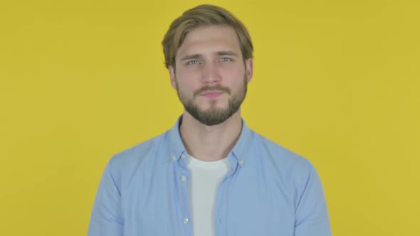Denying Young Man in Rejection on Yellow Background alt