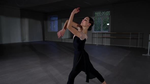 Concentrated Beautiful Woman Dancing in Studio Indoors Rehearsing Performance alt