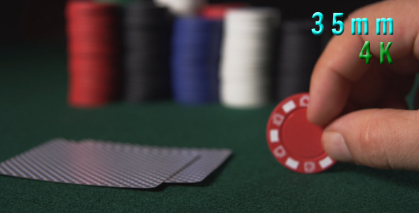 Poker Player Playing With Red Chip 38