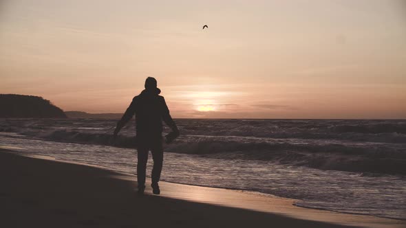 Man Walking near Sea alt
