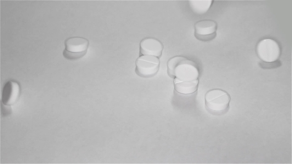 White Pills Scattered On The Table