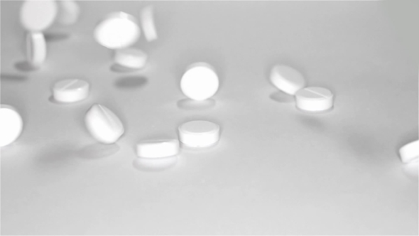 White Pills Scattered On The Table