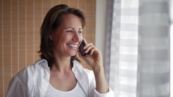 Smiling Woman Talking On The Phone